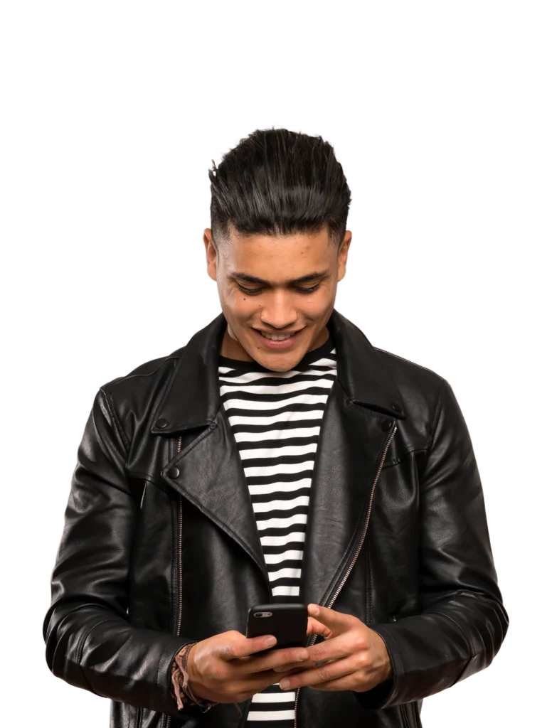 Stylish man in leather jacket looking at smartphone