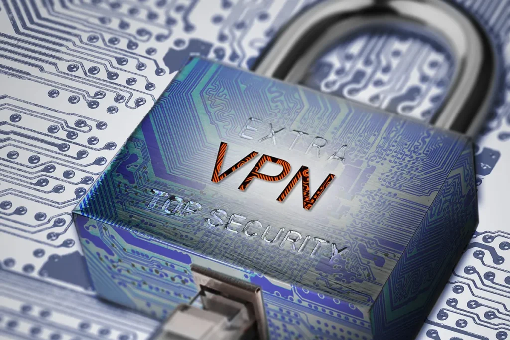 Padlock labeled “VPN” connected to a network cable over a circuit board, symbolizing encrypted internet connections and online privacy