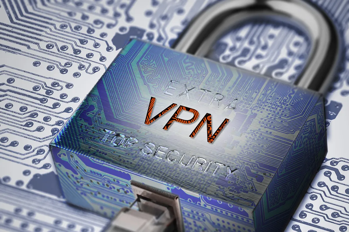 Padlock labeled “VPN” connected to a network cable over a circuit board, symbolizing encrypted internet connections and online privacy